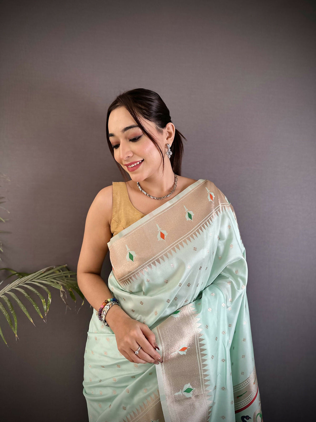 Sea Green Peacock and Floral Motif Lichi Silk Kanchipuram Saree