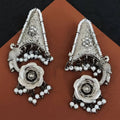 Close-up of premium oxidized silver flower design jhumka earrings with intricate ethnic detailing