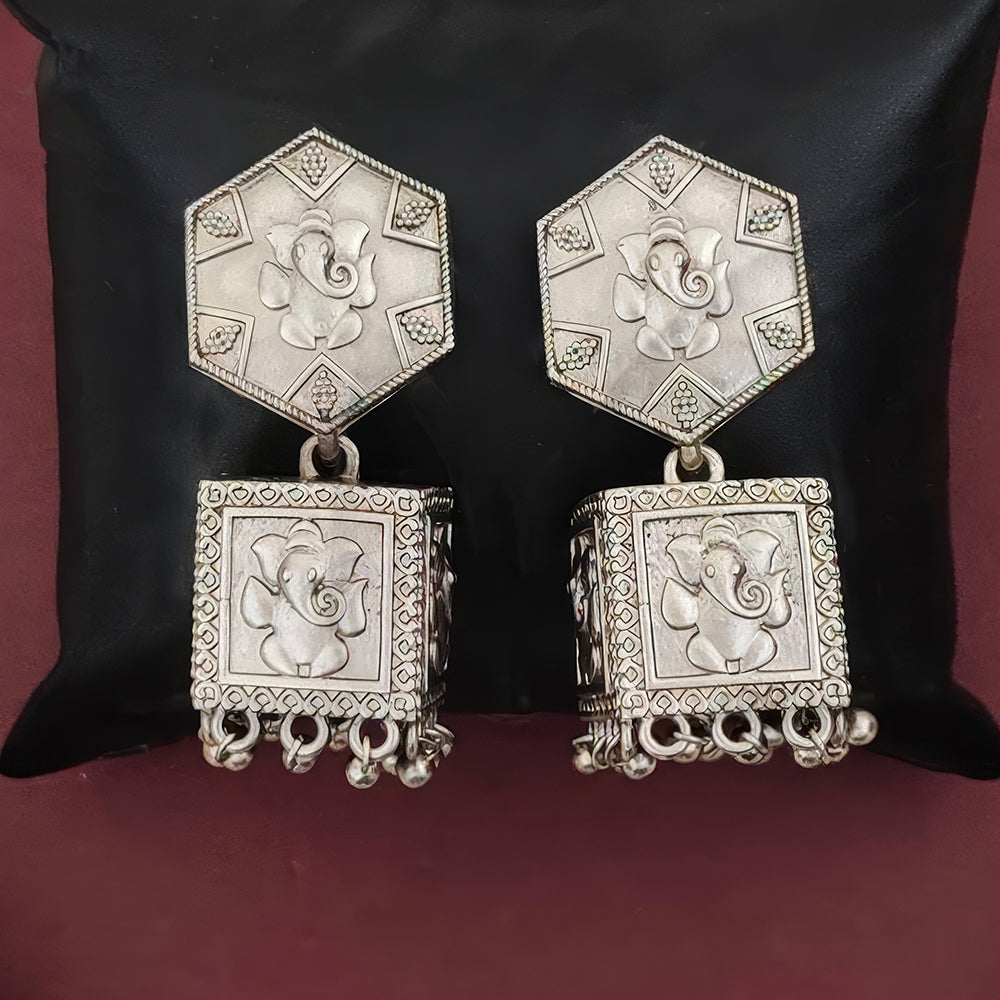 Antique oxidised silver earrings with intricate vintage detailing for women.
