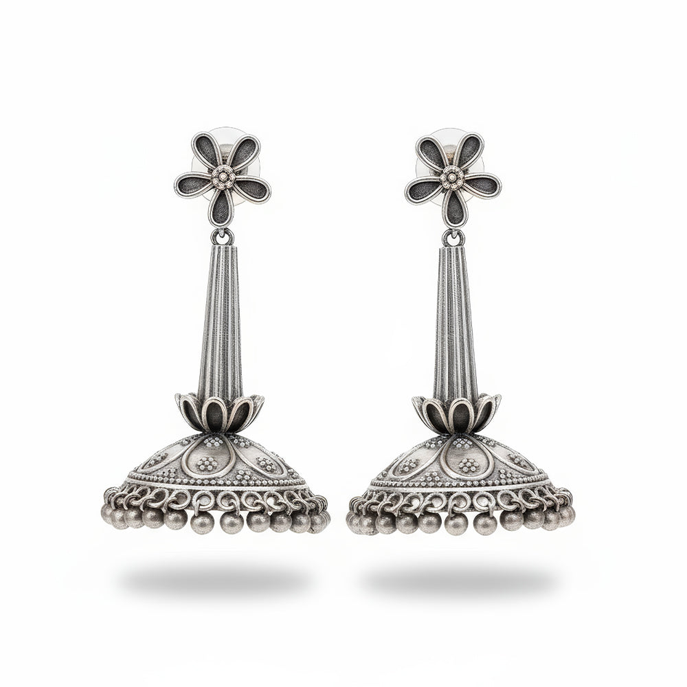 A pair of traditional oxidized silver earrings for girls, suitable for ethnic party wear.