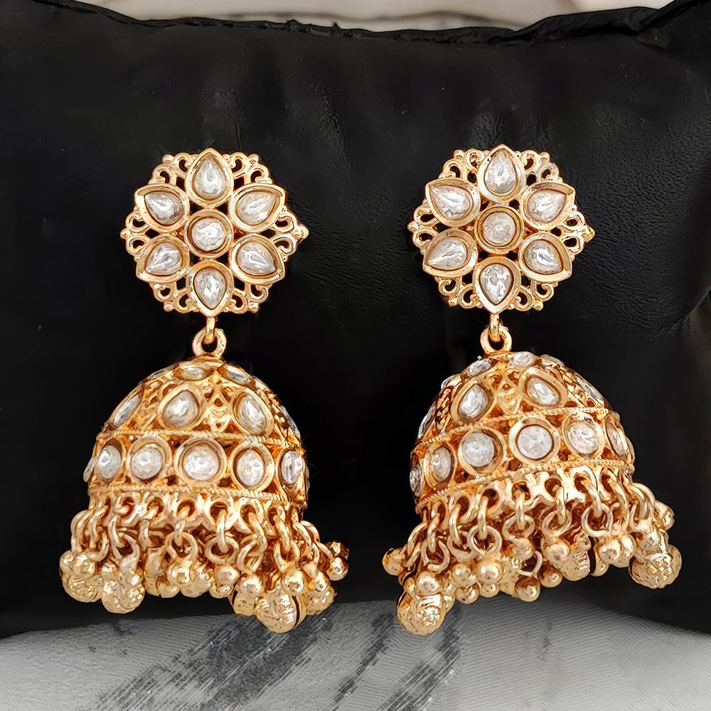 Antique jhumka earrings with high gold polish for a traditional Indian bridal look.