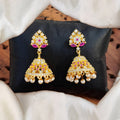 Short Jhumka earrings in gold with white and pink American Diamond stones for traditional party wear.