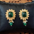 Antique gold-plated earrings with emerald green and white stones for ethnic wear