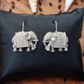 Designer oxidized silver jhumka and dangler earrings for women, featuring intricate ethnic metalwork.