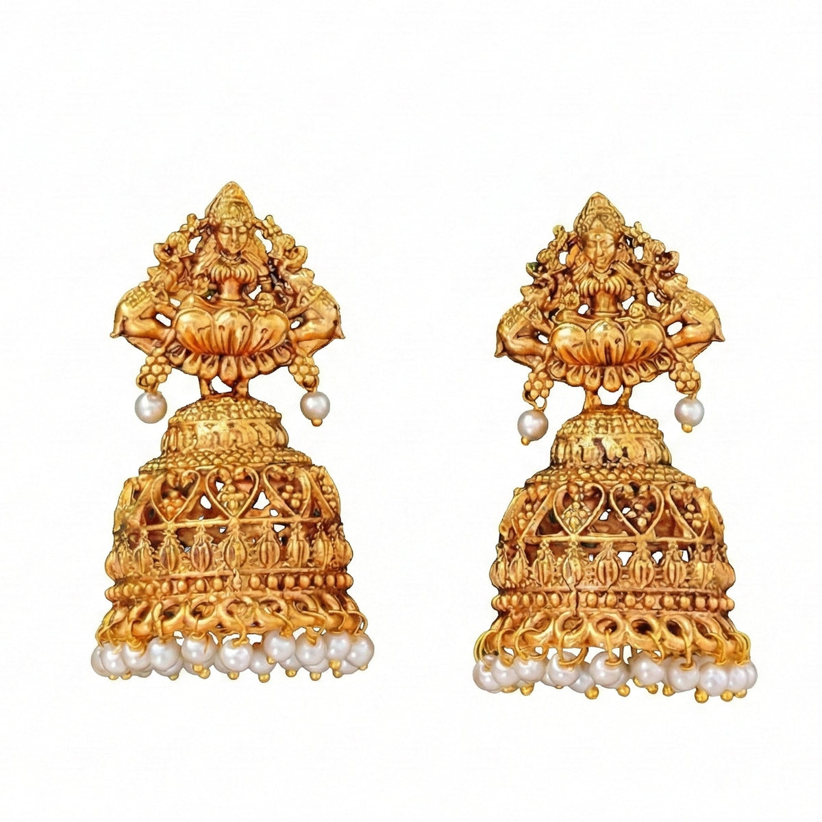 Antique gold jhumka earrings for girls featuring God Lakshmi carvings.