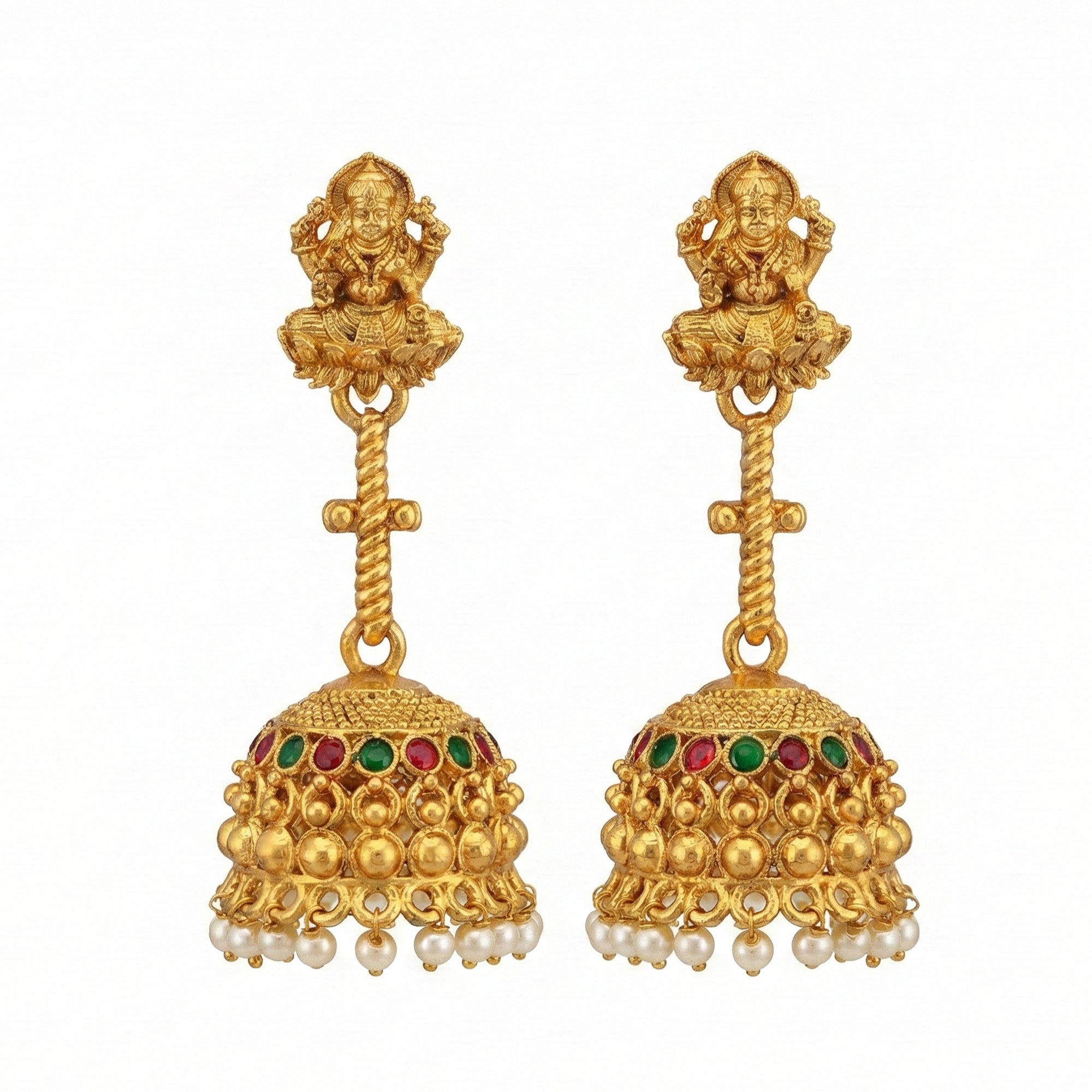 Close up of Traditional Rajwadi gold temple jhumka earrings with intricate carvings.