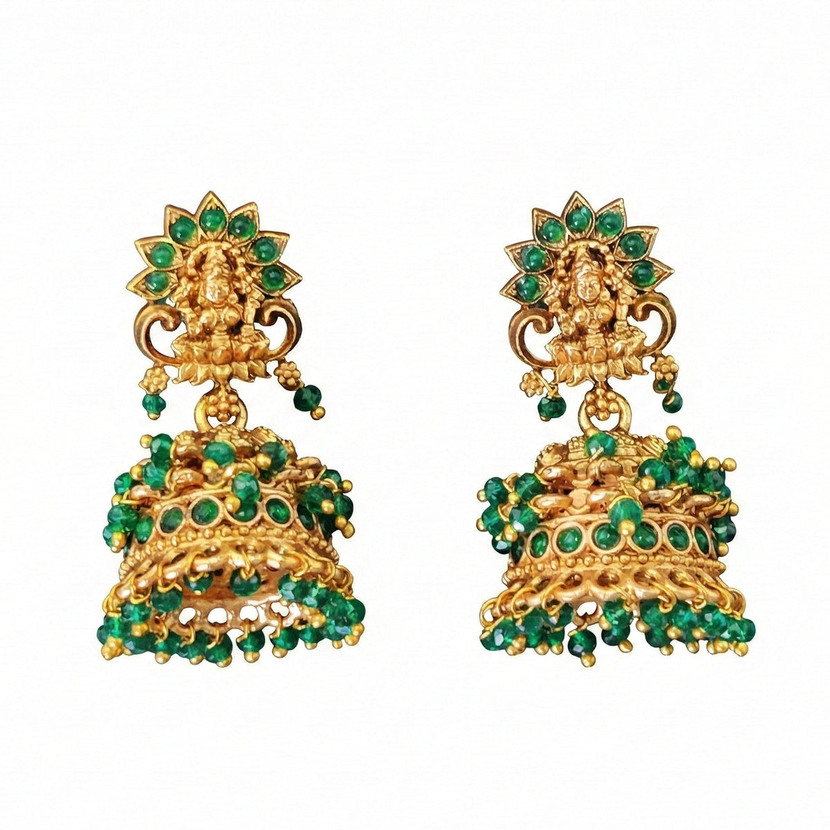 Girl wearing ornate temple design jhumka earrings with stone embellishments and Rajwadi polish
