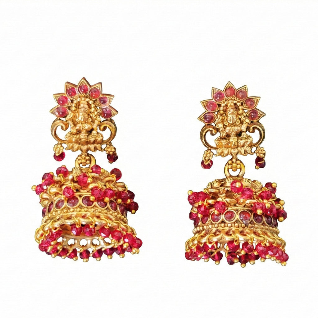 Traditional temple-style jhumka earrings with pink stone embellishments