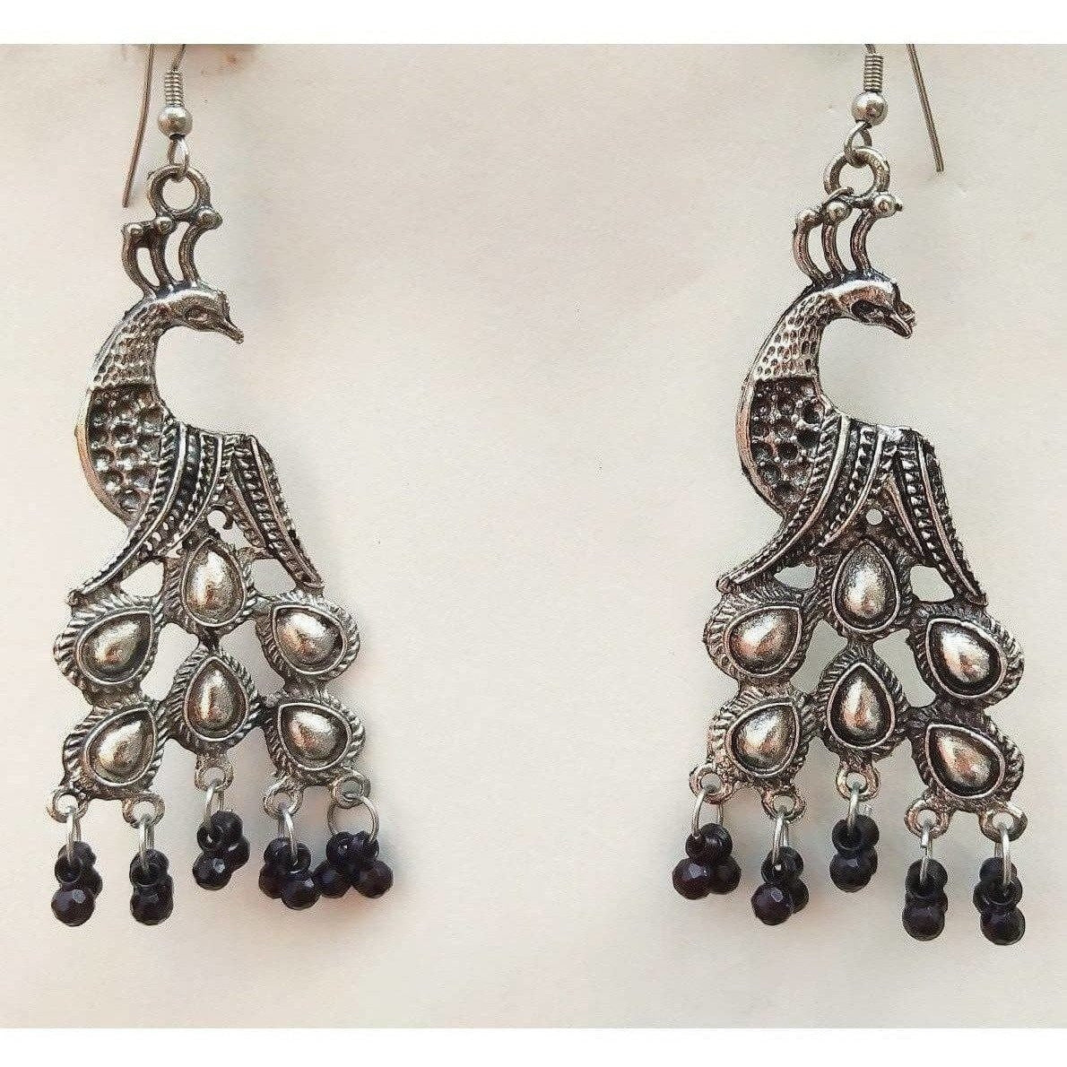 German silver oxidized peacock earrings with elegant black pearl drop details.