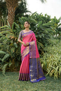 Stylish Pink Kanjivaram Silk saree with Zari detailing and a contrast blue blouse.