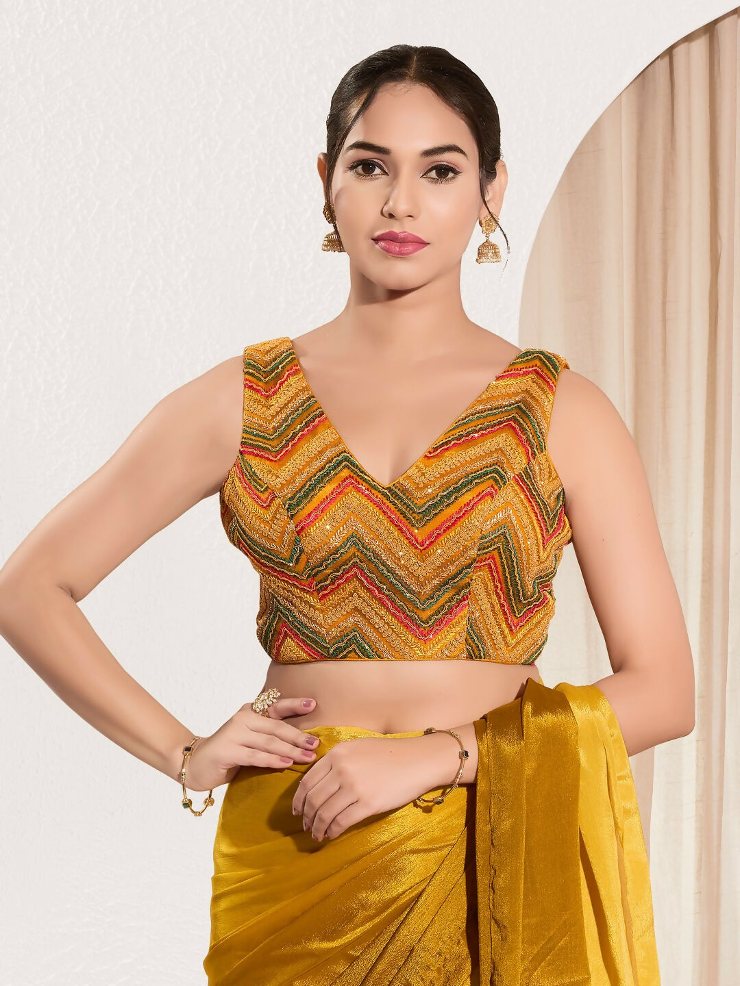 Mustard net sleeveless V-neck blouse with padding