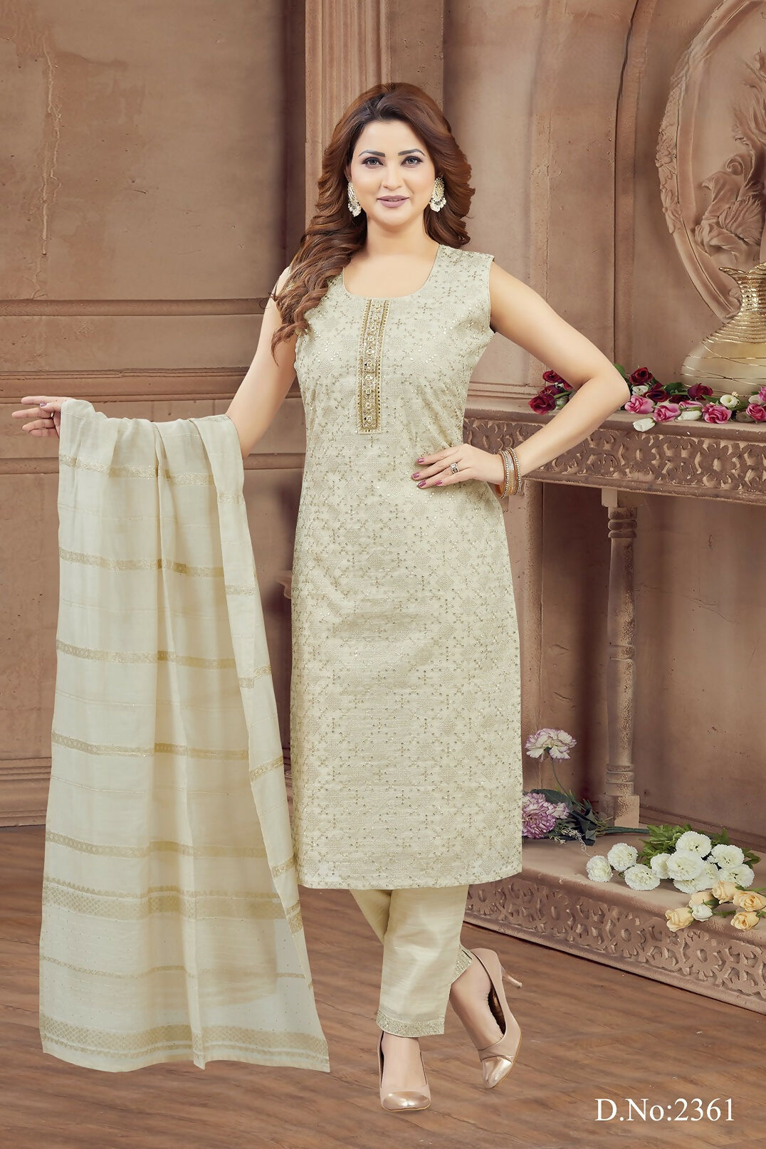Women wearing a cream tissue kurta set with detailed embroidery and round neck