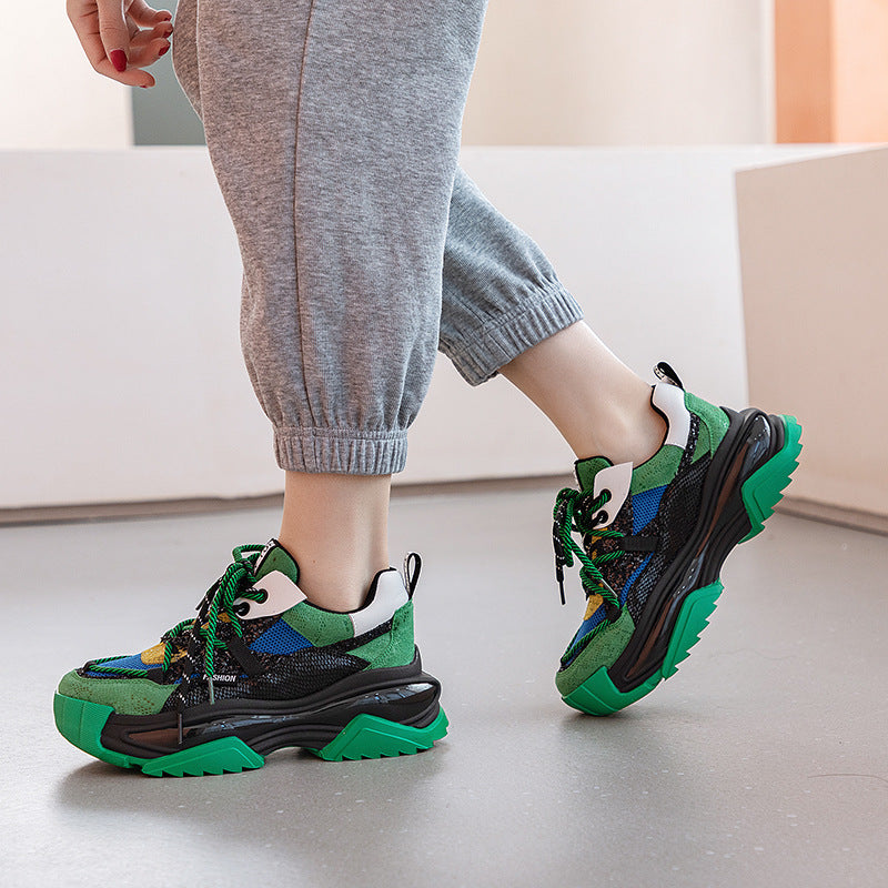 Harajuku-inspired chunky platform sneakers in vibrant multi-color and unique snakeskin patterns, showcasing thick soles and a modern street-style aesthetic.