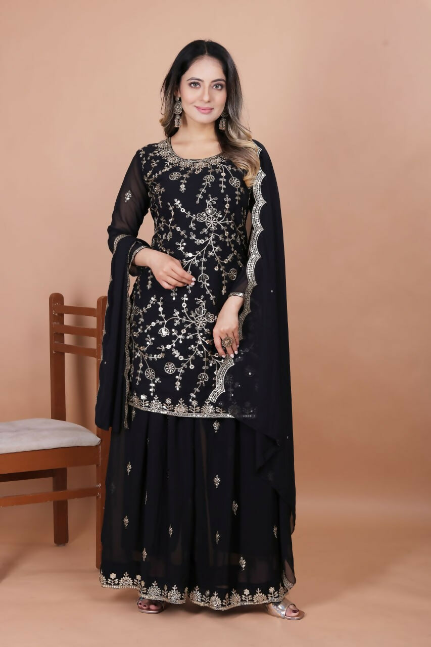 Elegant black georgette sharara set with intricate embroidery detailing on the kurti.