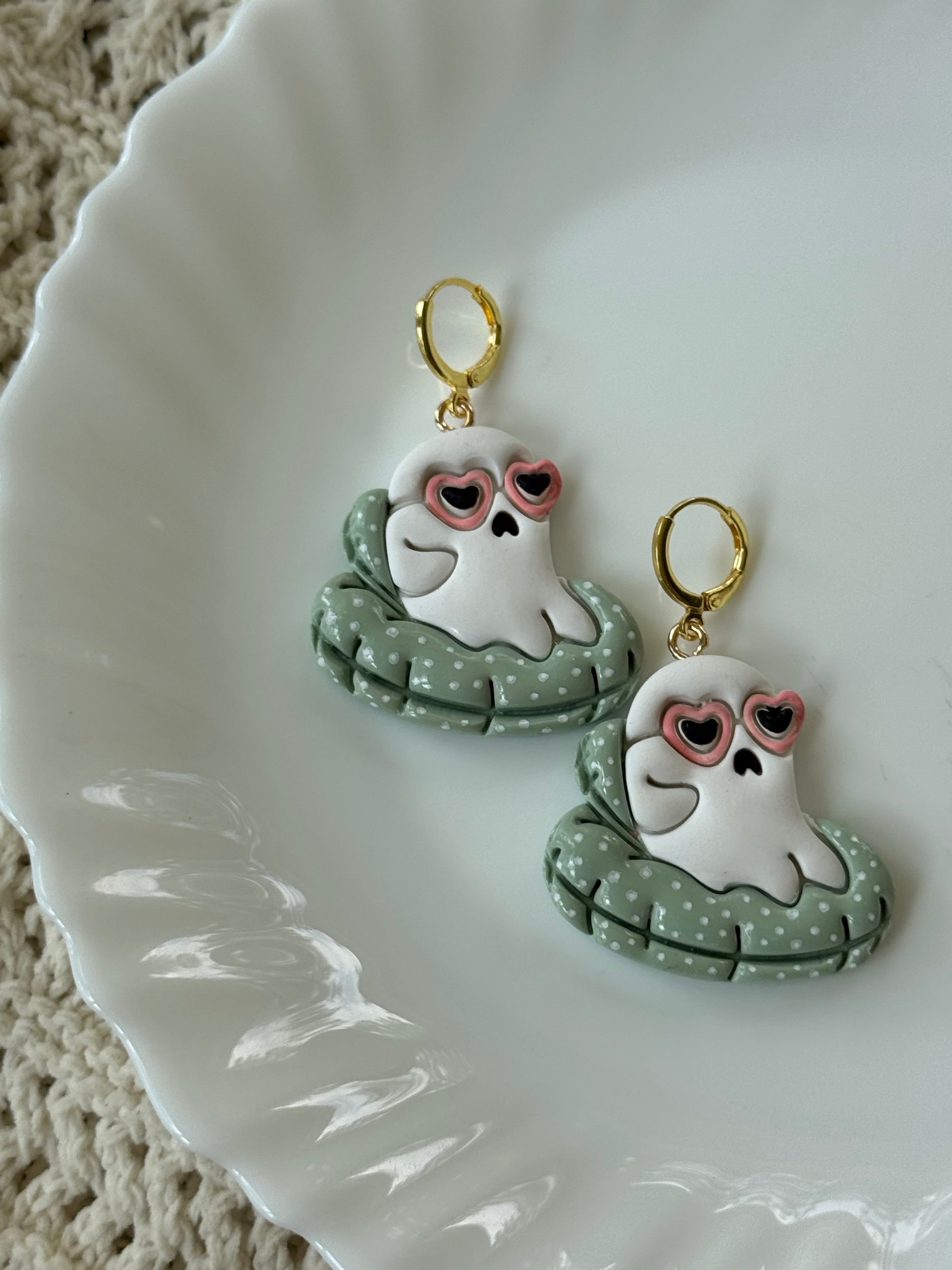Poolside Poltergeist earrings featuring white, sage-green, and pink polymer clay with gold accents.