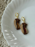Whimsical handmade dachshund polymer clay earrings with gold hardware.