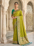 Elegant green Banarasi silk blend saree with traditional weave and matching blouse piece.