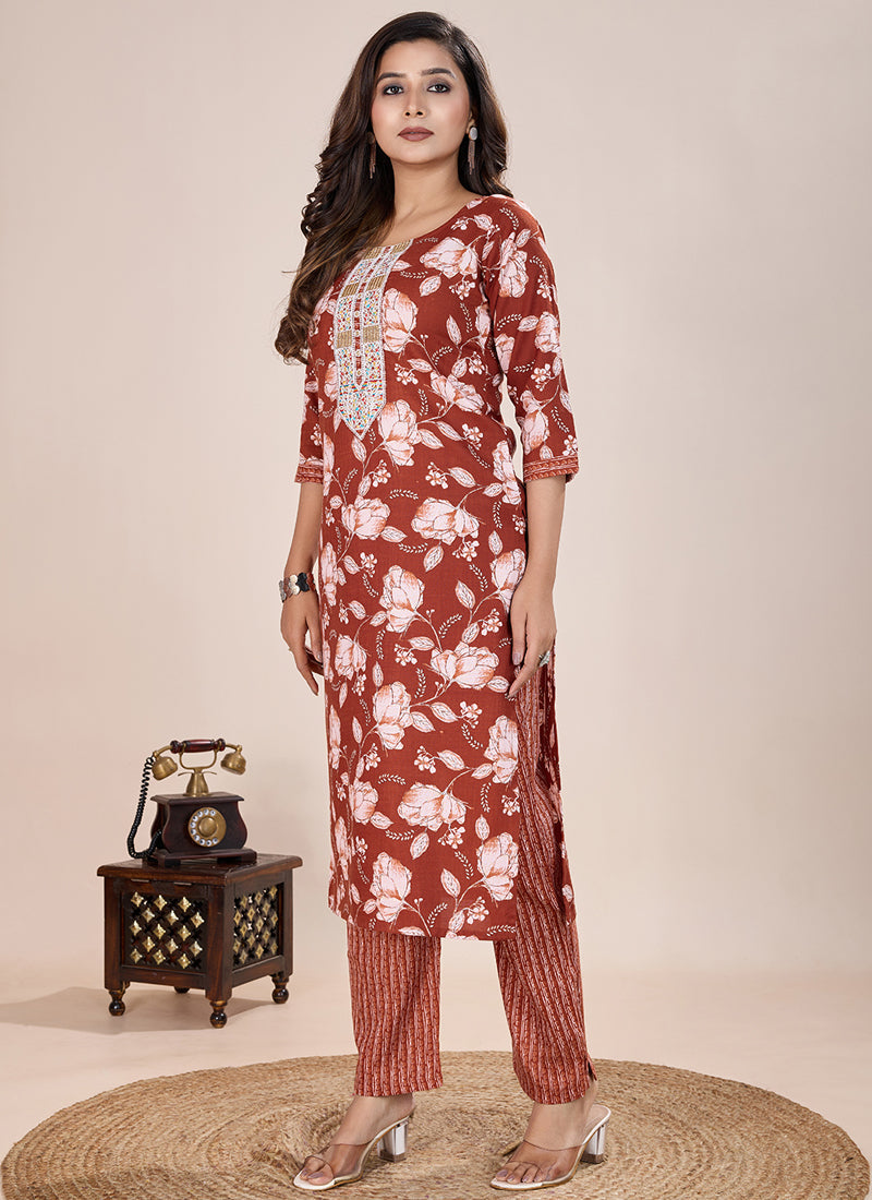 Orange printed cotton blend kurta paired with matching printed pants