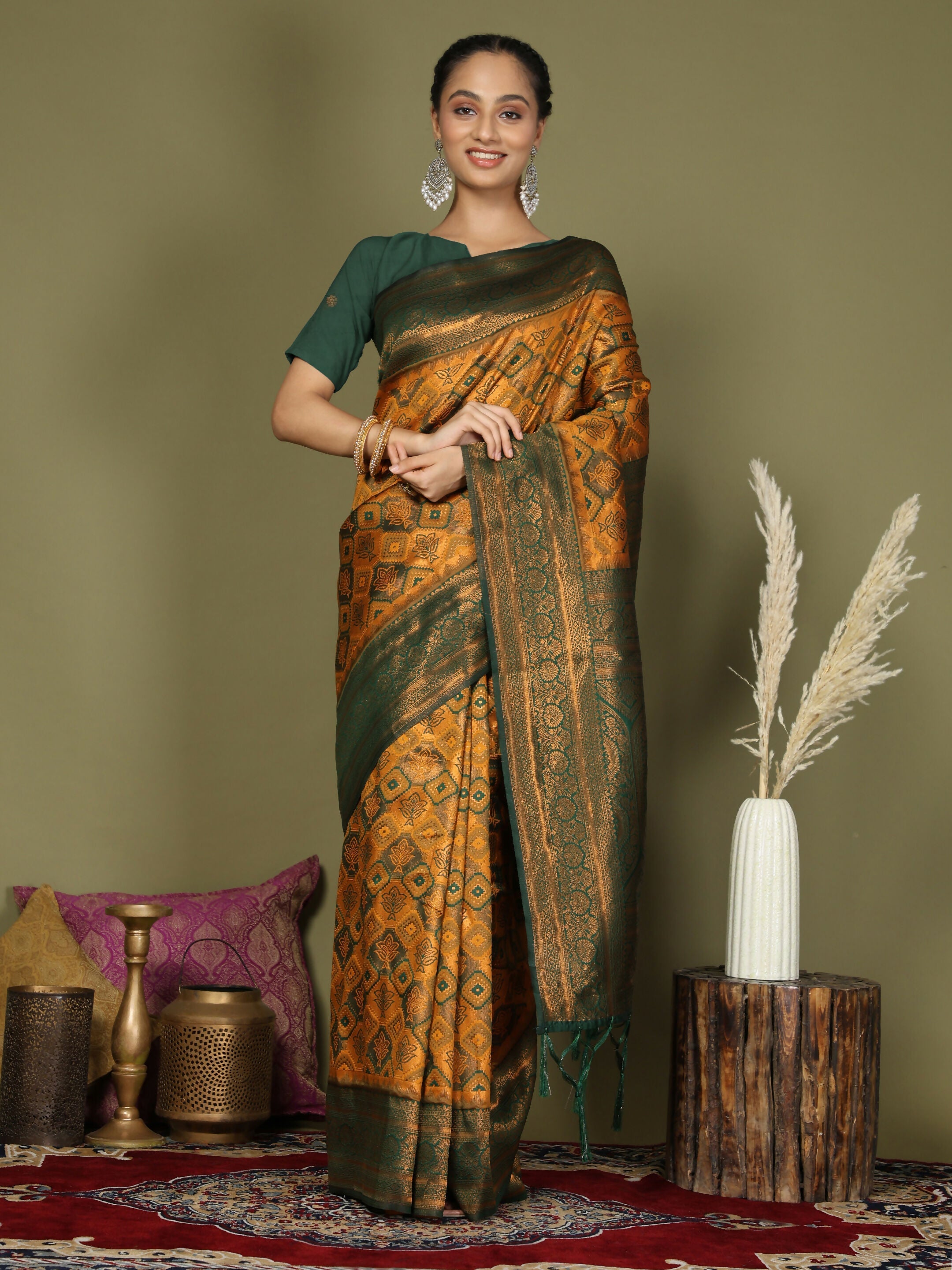 Bright Yellow Lichi Silk saree with contrasting Green blouse.