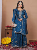 Model wearing a Royal Blue Vichitra silk sharara suit with intricate sequin and thread embroidery.
