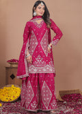 Front view of a pink chinon silk sharara suit with detailed sequin and thread work embroidery.