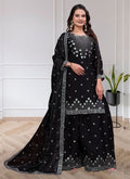 Elegant black Chinon silk sharara suit with intricate sequin embroidery.