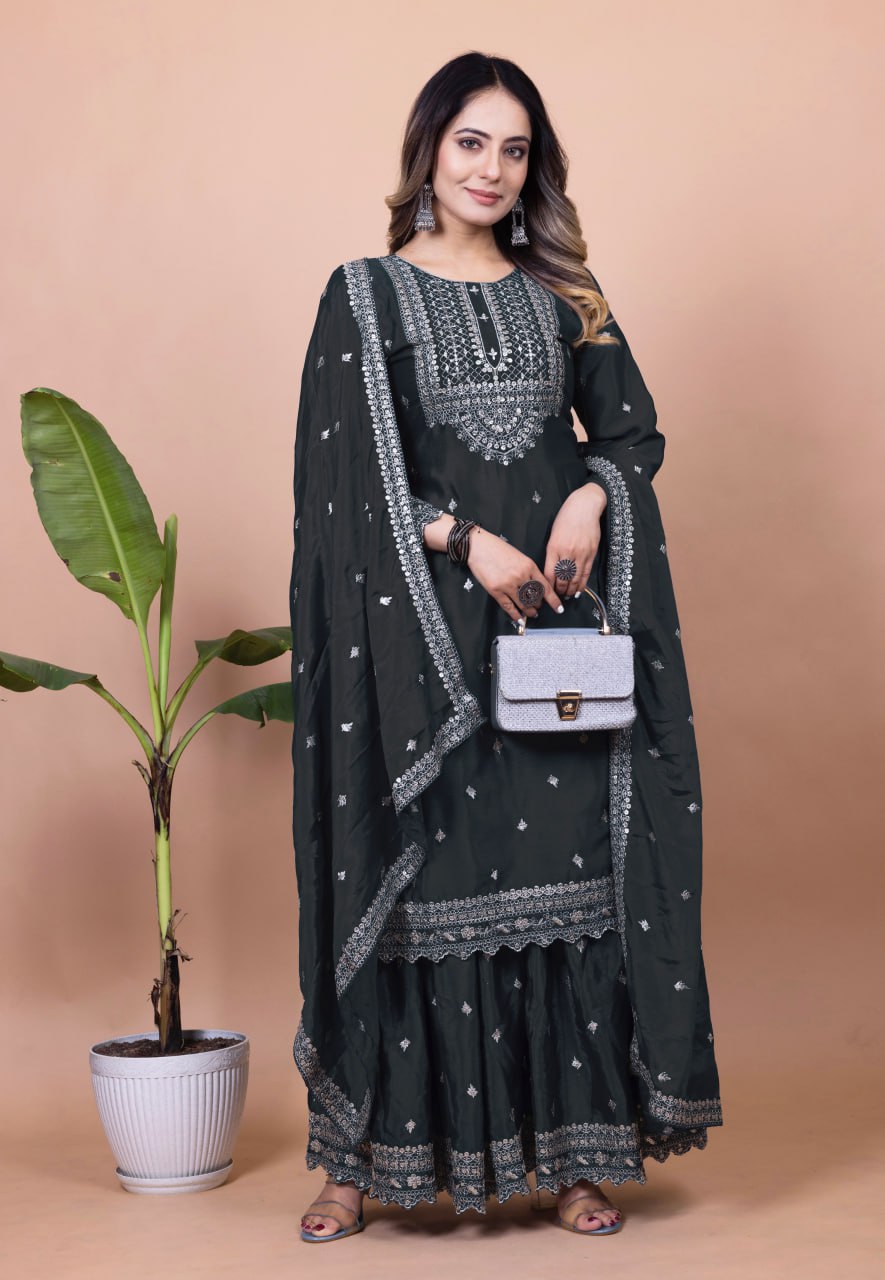 Model wearing a black Chinon silk sharara suit with heavy sequence embroidery