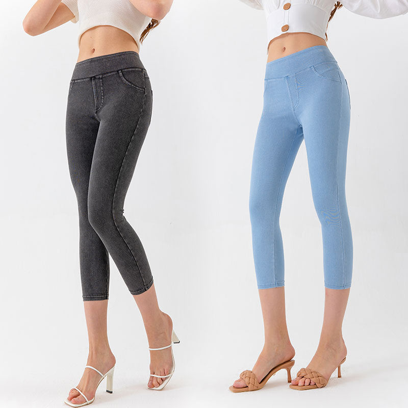 Model wearing slim-fit denim-style yoga capri pants in blue