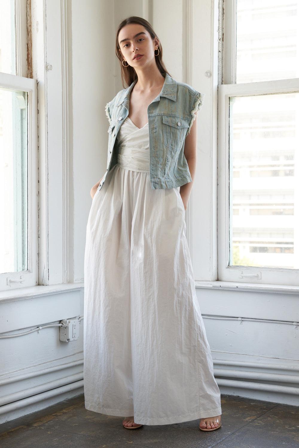 Distressed Light Wash Denim Vest with Raw Edge Armholes