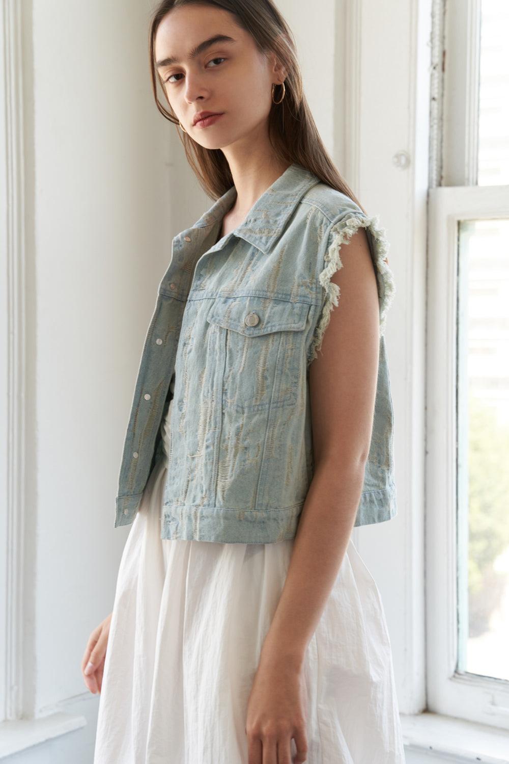 Distressed Light Wash Denim Vest with Raw Edge Armholes