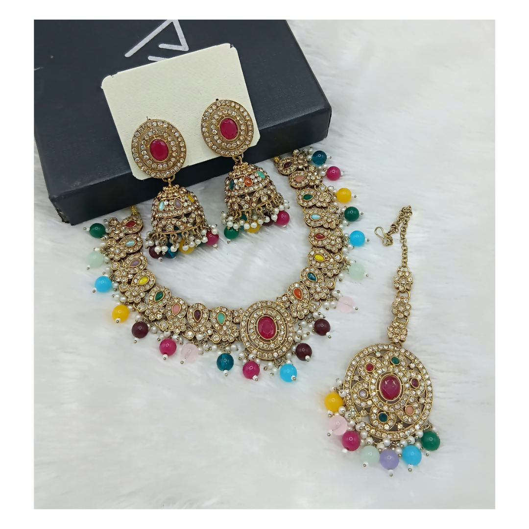 Multi-stone statement necklace set with matching drop earrings on a clean background