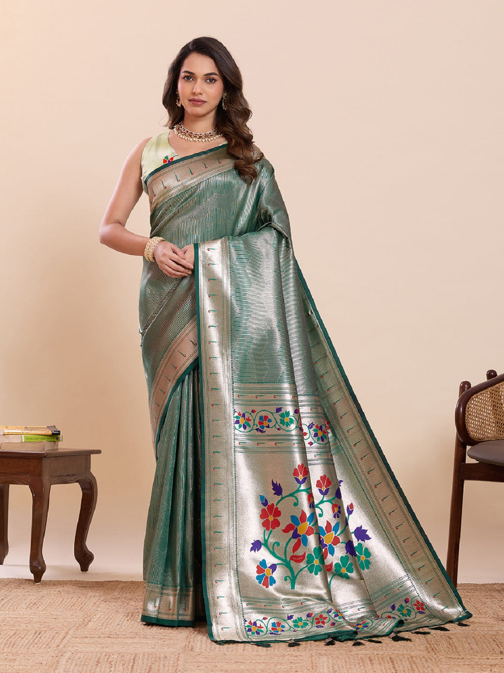 Green pure soft silk saree with intricate woven lotus motifs.