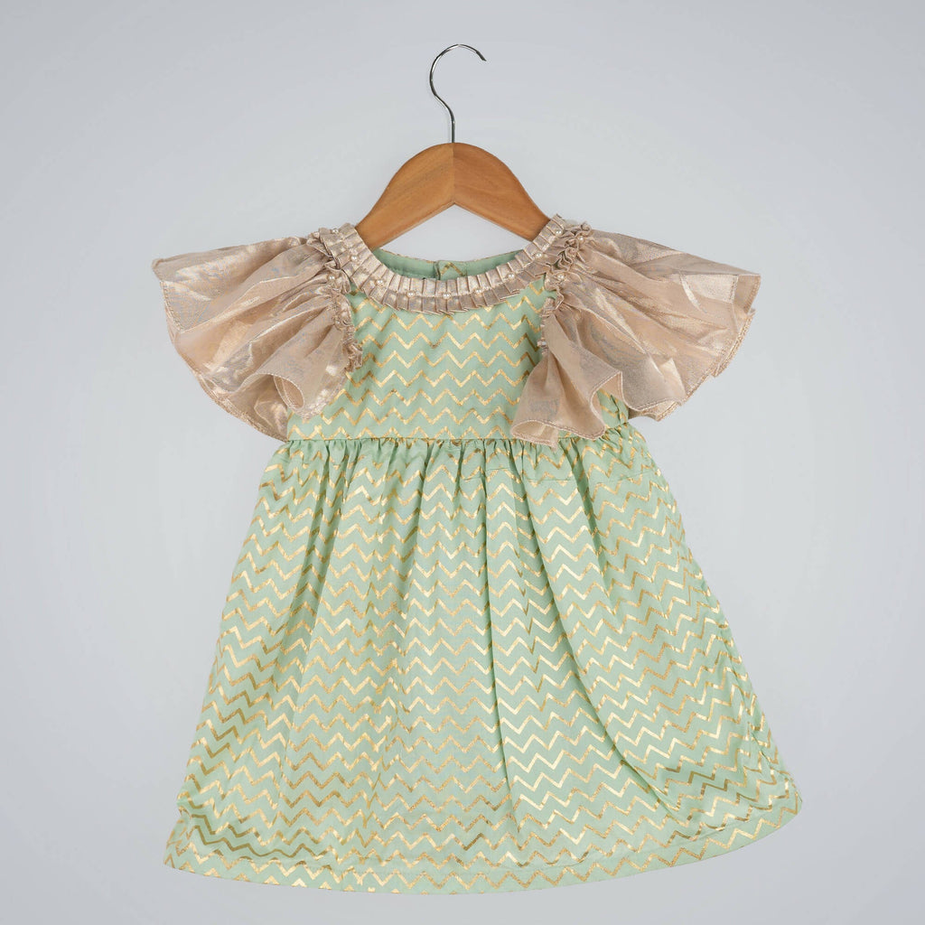 Girls green zig-zag print dress with gold lame bell sleeves and pleated round neck