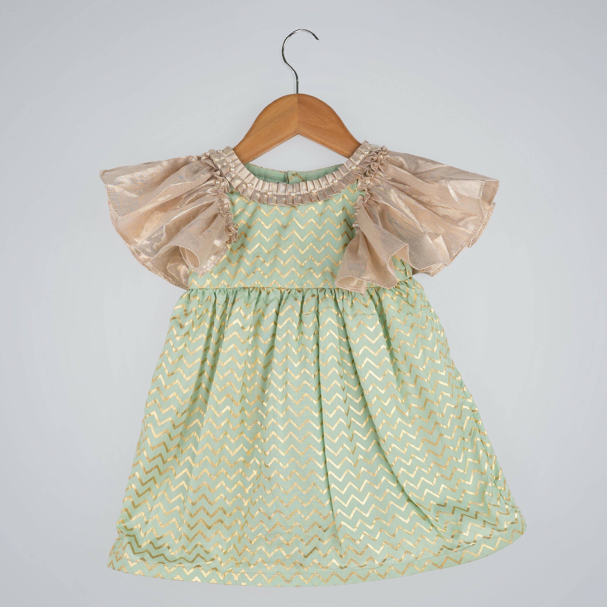 Girls green zig-zag print dress with gold lame bell sleeves and pleated round neck