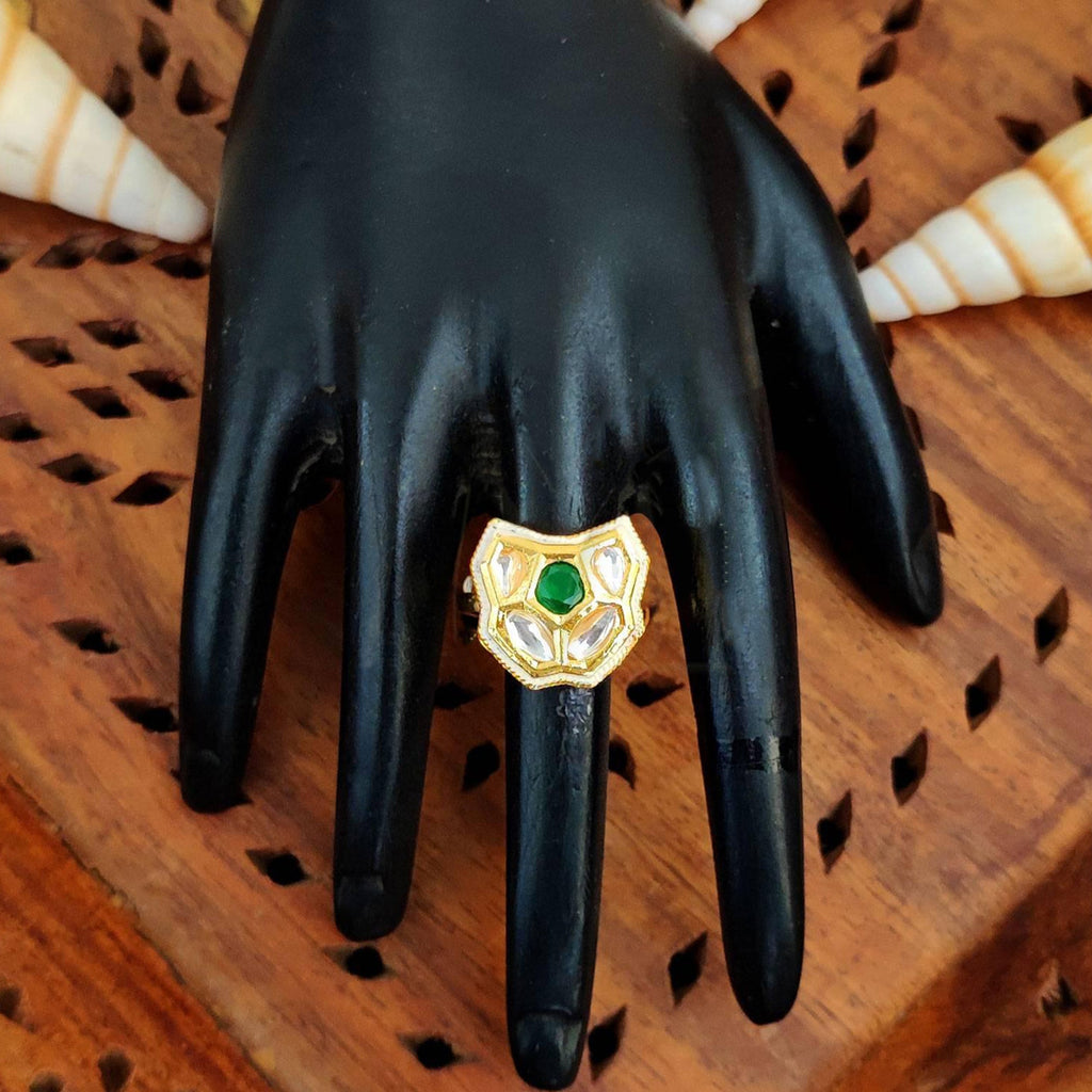 A traditional Kundan finger ring with multi-colored center stones and a polished high gold finish on an adjustable band.