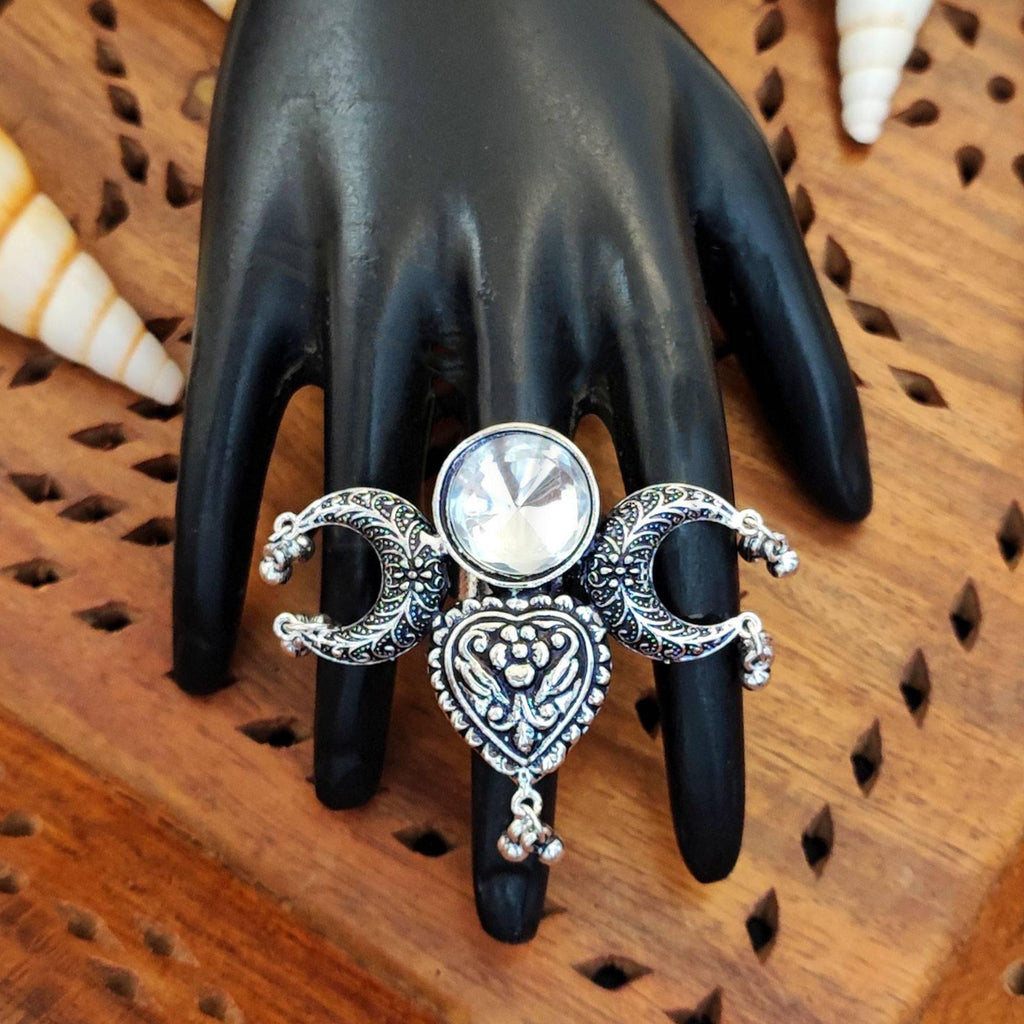 Antique oxidized silver finger ring with a dangling drop charm in a bohemian style