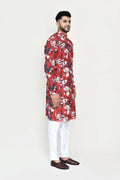 Woman wearing a maroon rayon kurta with thread and sequence embroidery paired with white straight-fit art silk pants