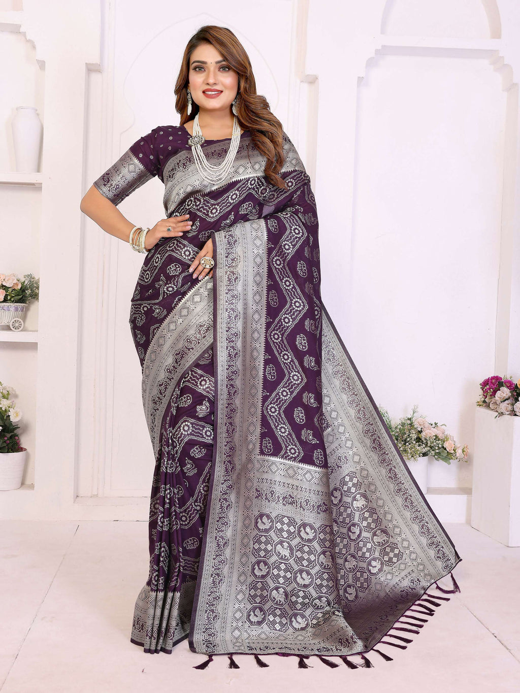 Deep wine colored georgette silk saree with elegant zari leheriya pattern