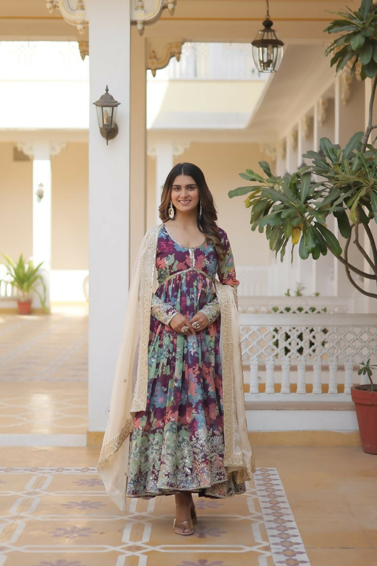 Wine-colored Russian Silk Anarkali dress with elaborate sequins and zari embroidery detail.