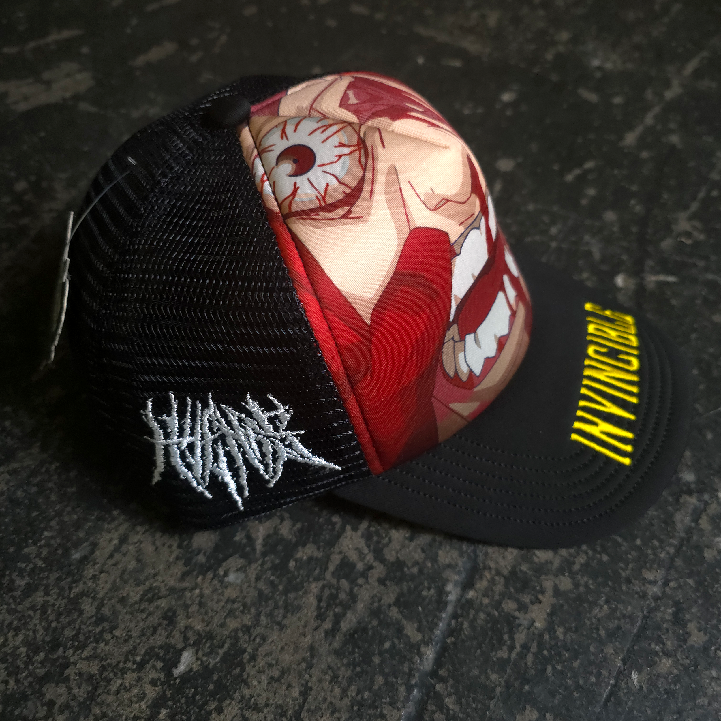 Invincible Face Smasher Graphic Trucker Hat in Black - Image 2