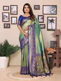 A green tissue silk saree featuring intricate weaving and a subtle, luxurious sheen.