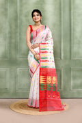 Elegant white embellished cotton blend Jamdani saree draped gracefully for a festive ethnic look.