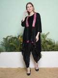 Elegant black dhoti salwaar set with a matching inner and hand-embellished velvet jacket
