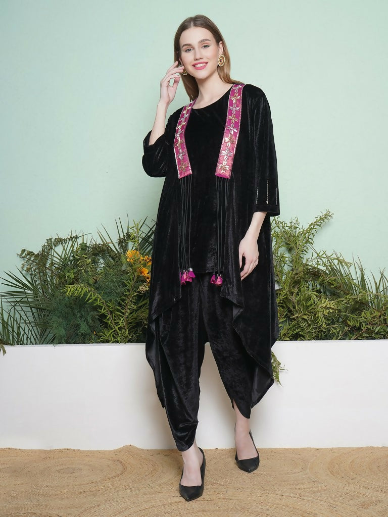 Elegant black dhoti salwaar set with a matching inner and hand-embellished velvet jacket