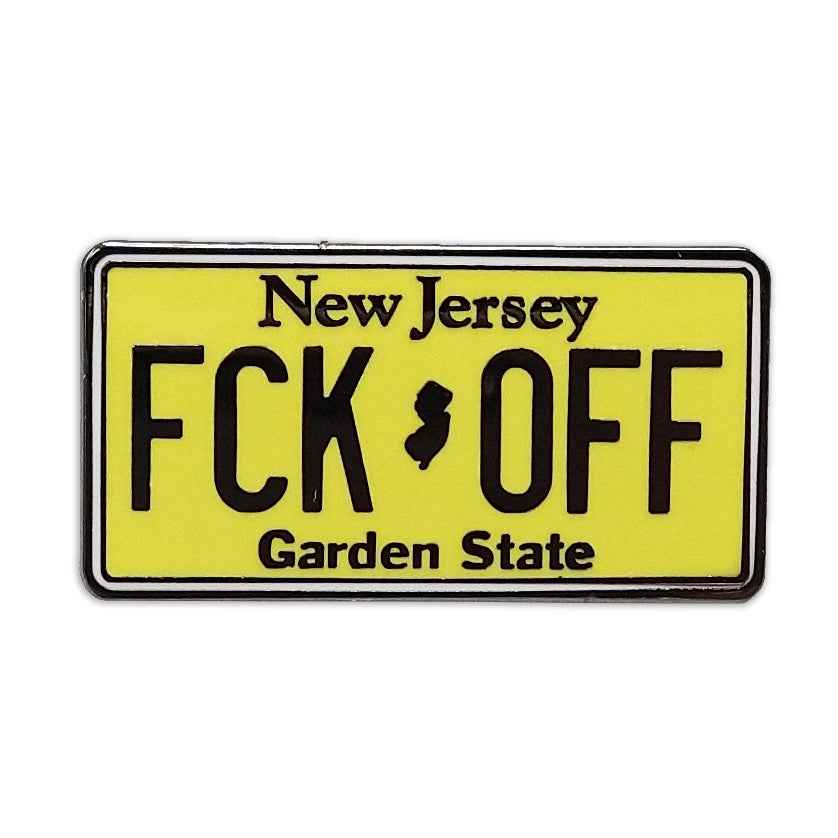 F-ck Off License Plate enamel pin with bold lettering, attached to a jacket lapel