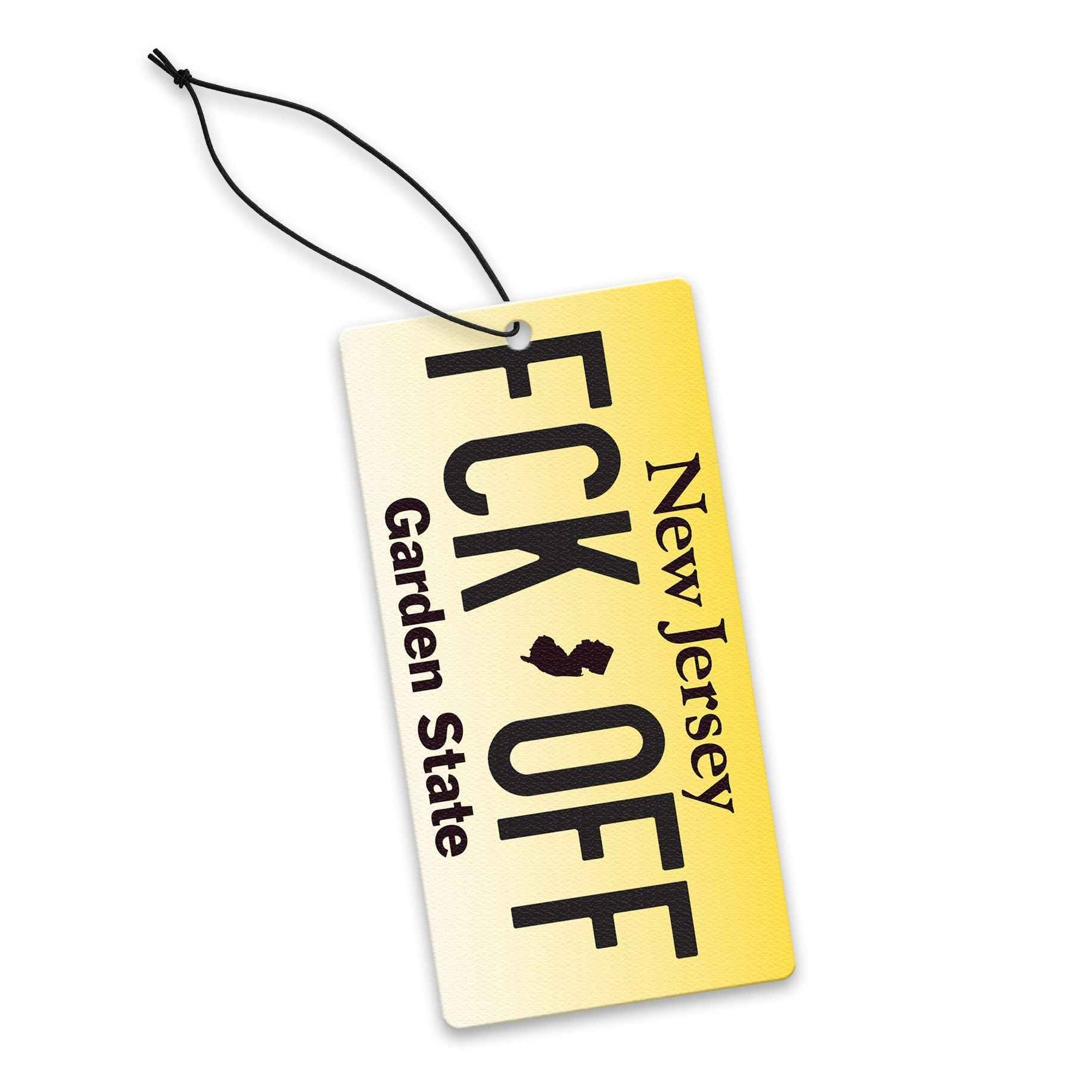 Yellow license plate style FCK-OFF novelty car air freshener hanging in a vehicle