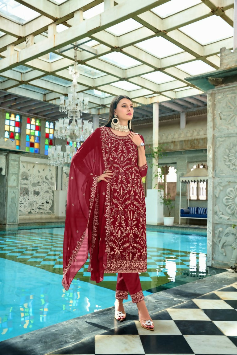 Maroon faux georgette kurta set with heavy embroidery and Moti pearl work.