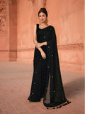 Classic black cotton saree for women, featuring a versatile look for ethnic occasions.