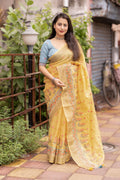 Yellow pure linen saree with ethnic motifs, zari border, and phantom silk embroidered blouse