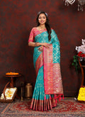 A beautiful Firozi Organza Silk saree with rich Meenakari woven pallu and matching silk blouse.